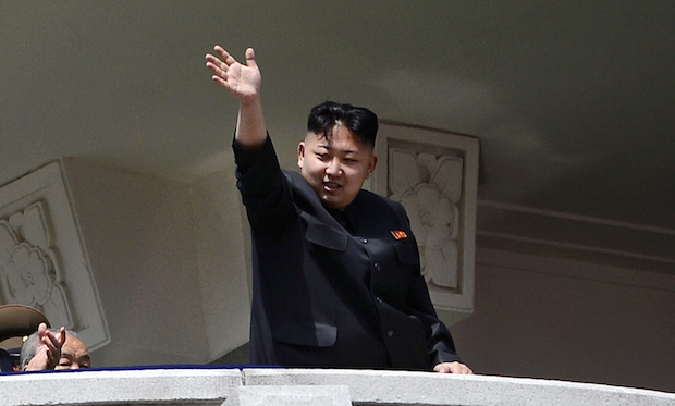 North Korea's leader Kim Jong-Un waves a